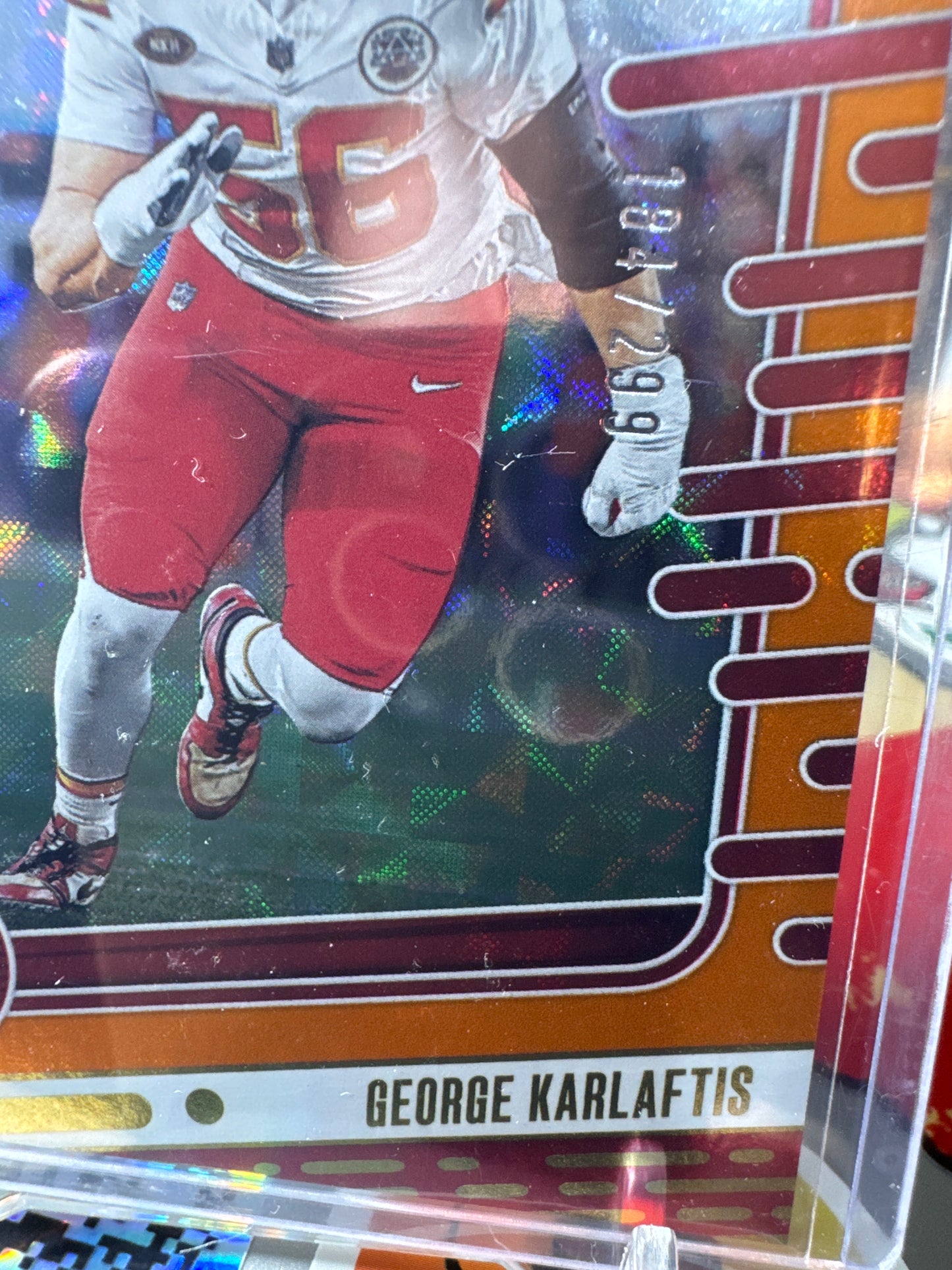 2024 Panini Absolute #53 George Karlaftis- Orange Mosaic Foil Parallel. Numbered 184/299