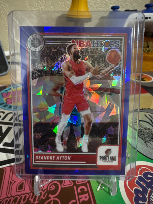 2023 Panini Hoops Premium Stock #11 Deandre Ayton- Blue Cracked Ice Parallel. Numbered 68/99