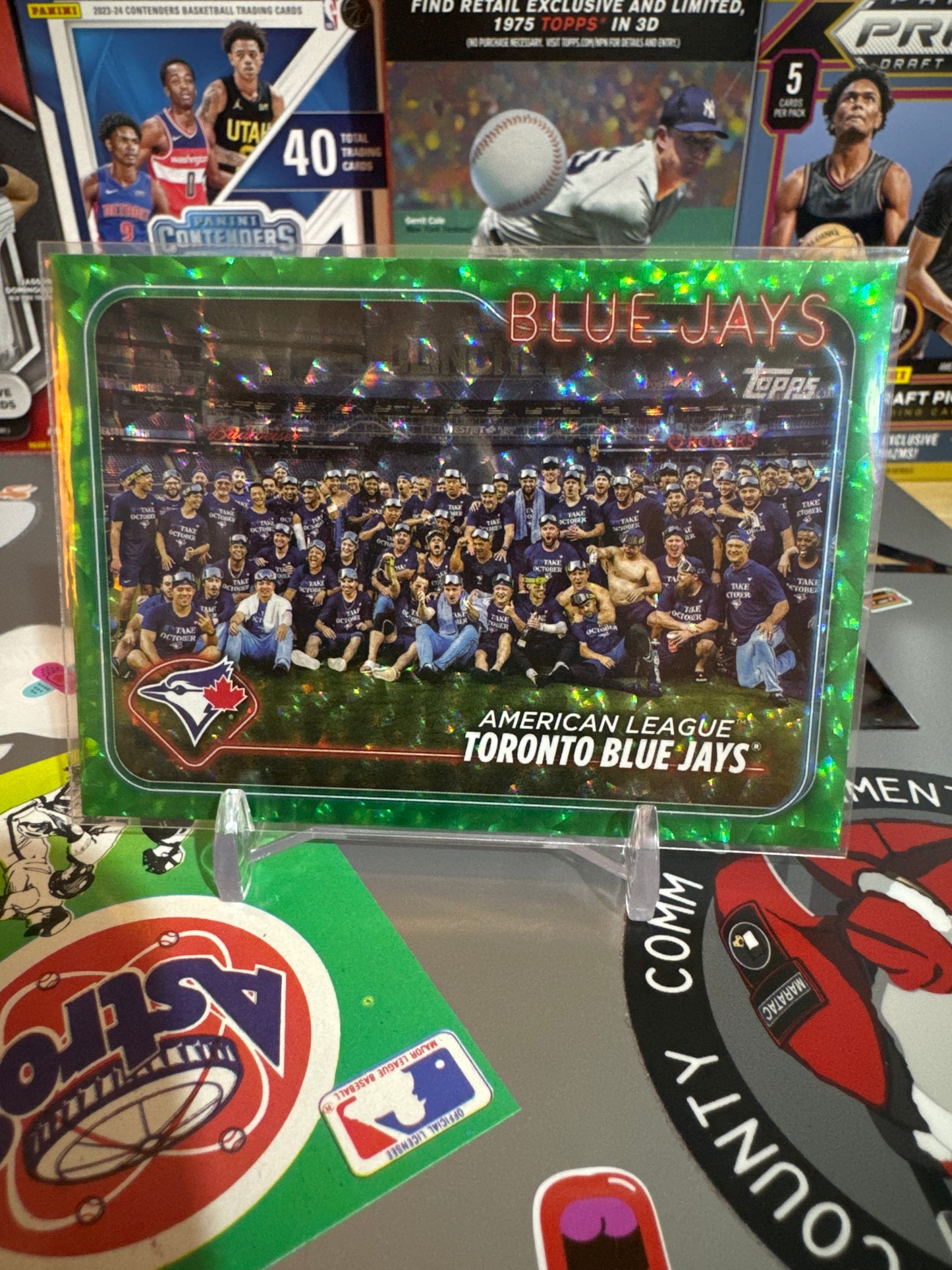 2024 Topps Base set Series 2 #604 Toronto Blue Jays. Green foil. Numbered 416/499